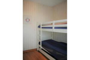 a bunk bed room with two bunk beds in it at Albatros D2 in De Haan