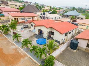 an aerial view of a house with palm trees at Capricorn Heights BnB 2 bedrooms Apartment at Kwabenya, Accra, Balloon Gate in Kwabenya