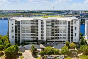 an aerial view of a large apartment building at North Shore Oceanside Kawana in Kawana Waters