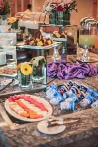 a buffet of food on a table with plates of food at V8 Hotel Johor Bahru in Johor Bahru