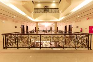 a balcony with a wrought iron railing in a building at Voyage Apartments in Riyadh