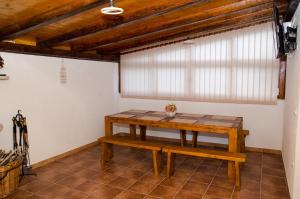 a room with a wooden table and a bench at Apartment Ante in Klek +18 photos