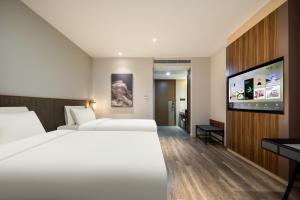 Katil atau katil-katil dalam bilik di Atour X Hotel Hangzhou Binjiang Torch Avenue +33 gambar