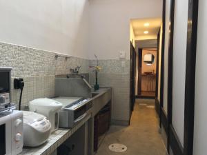 a bathroom with a sink and a toilet in it at 古都庵Koto-an Japanese Town house in Kyoto +47 photos