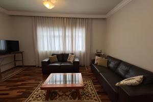 Μια τηλεόραση ή/και κέντρο ψυχαγωγίας στο Apartamento Central em Araxá