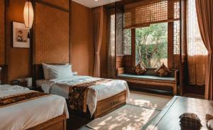 Postel nebo postele na pokoji v ubytování Ganzhou Banjiangxia Homestay