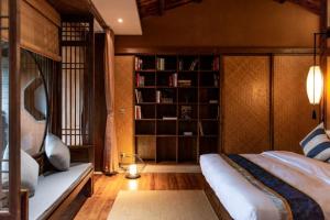 Postel nebo postele na pokoji v ubytování Ganzhou Banjiangxia Homestay