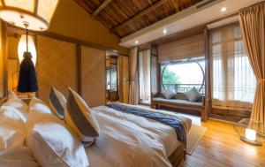 Postel nebo postele na pokoji v ubytování Ganzhou Banjiangxia Homestay