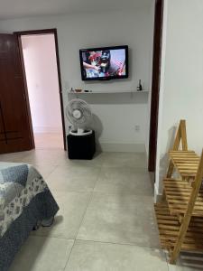 TV a/nebo společenská místnost v ubytování Loft Moderno no Centro de Guarapari + 11 fotografií