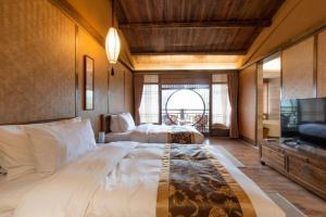 Postel nebo postele na pokoji v ubytování Ganzhou Banjiangxia Homestay