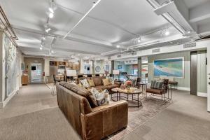 a living room with a couch and a table at Rustic Suite 6BR by Maddox Hotel in Nashville