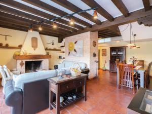 a living room with a couch and a fireplace at Cottage in Navas de Estena with Pool & Jacuzzi in Navas de Estena