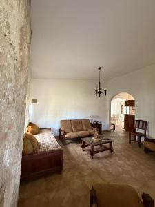a living room with a couch and a table at Chalet Pino azul in Villa Carlos Paz