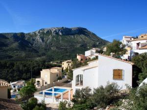 a view of a village with a mountain in the background at Villa in Monte Pego near Stunning Beaches in Adsubia