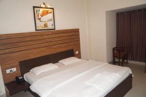 Voodi või voodid majutusasutuse HoTEL CENTER POINT toas