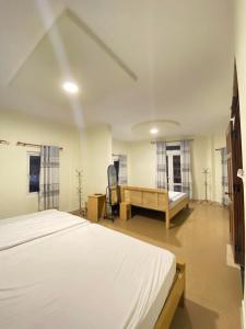 Katil atau katil-katil dalam bilik di 05 Đoàn Thị Điểm Hotel