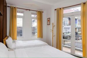 Katil atau katil-katil dalam bilik di 05 Đoàn Thị Điểm Hotel