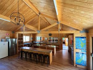 a kitchen with wooden ceilings and a large wooden table at Kingston TOP 10 Holiday Park in Kingston