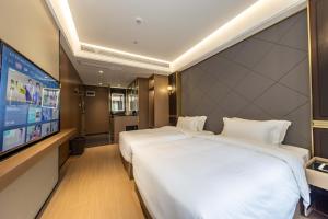 Televiisor ja/või meelelahutuskeskus majutusasutuses 万仕达酒店Vanisdar Hotel +5 fotot
