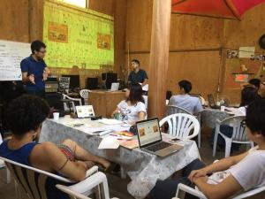 un groupe de personnes assises à des tables dans une pièce dans l'établissement Lilac Hotels and Resorts - Vacation STAY 53247v, à Kanoya