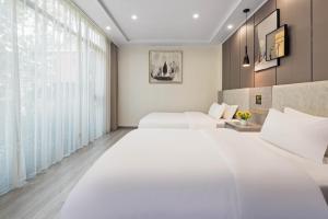 Voodi või voodid majutusasutuse 逸园设计师网红酒店 天府机场店 toas