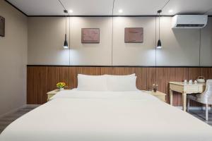 Voodi või voodid majutusasutuse 逸园设计师网红酒店 天府机场店 toas
