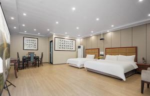 Voodi või voodid majutusasutuse 逸园设计师网红酒店 天府机场店 toas