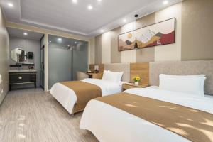 Voodi või voodid majutusasutuse 逸园设计师网红酒店 天府机场店 toas