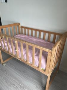 a wooden bunk bed with pink sheets on it at Ruang Hening in Seri Kembangan +22 photos