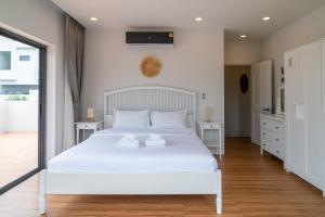 Postel nebo postele na pokoji v ubytování Villa Yin 2BR Cosy Oasis with a Private Pool + 17 fotografií