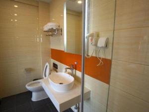 a bathroom with a sink and a toilet at 7 Days Premium Beijing Dabaotai Metro Station Luhua Road in Beijing +143 photos