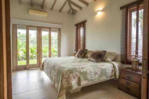 Ένα ή περισσότερα κρεβάτια σε δωμάτιο στο Finca luxury Villavicencio Restrepo