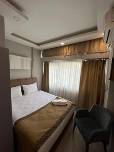 A bed or beds in a room at Class Hotel