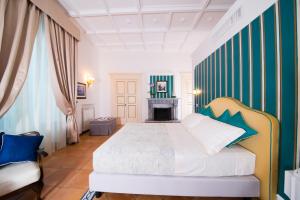 Postel nebo postele na pokoji v ubytování B&B Maiurè