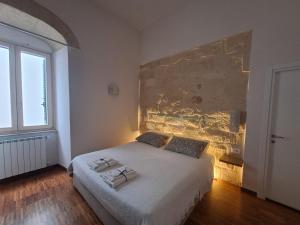 Postel nebo postele na pokoji v ubytování Muragie del Castello B&B