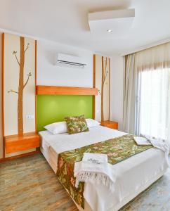 Cama o camas de una habitación en Çınarlar Apart Hotel KAŞ