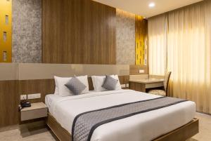 Rathna Residency客房内的一张或多张床位