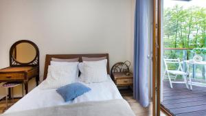 Ένα ή περισσότερα κρεβάτια σε δωμάτιο στο Nadmorski Rentyear Apartments