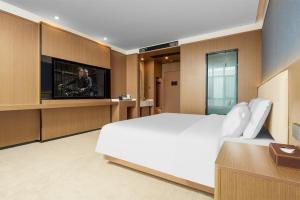 TV a/nebo společenská místnost v ubytování May Joys Hotel