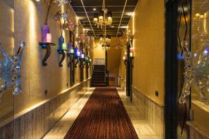 a hallway with a long aisle with colorful lights at Hotel Sebastians in Amsterdam