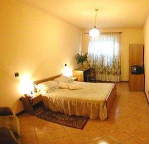 Postel nebo postele na pokoji v ubytování Hotel Sassacci + 12 fotografií