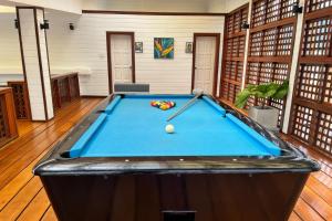 a pool table in the middle of a room at Days Inn by Wyndham Patong Beach in Patong Beach