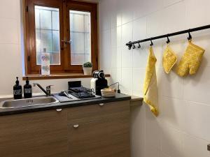 a kitchen with a sink and a counter top at Holiday home with lake-view -Breck&fest in Blevio +49 photos