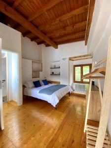 a bedroom with a bed and a wooden ceiling at Holiday home with lake-view -Breck&fest in Blevio