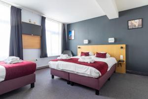Postel nebo postele na pokoji v ubytování Hotel Montovani