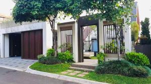 a house with a gate and trees and grass at Vila Princess, Vimala hills 3bedroom Private Pool, Mountain View, Piano, 0813 delapan 0 satuenam 4 satu 51 in Bogor