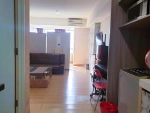 Televisyen dan/atau pusat hiburan di CGK Airport Summer Grand Studio Family Ensuite