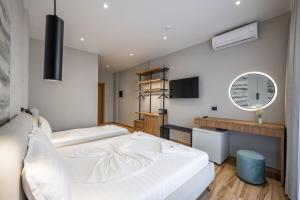 Postel nebo postele na pokoji v ubytování Hotel Kroi