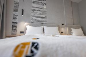 Postel nebo postele na pokoji v ubytování Hotel Kroi