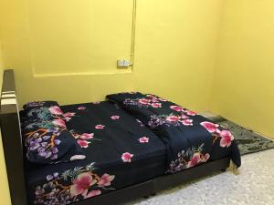 Postel nebo postele na pokoji v ubytování Homestay D'Besut